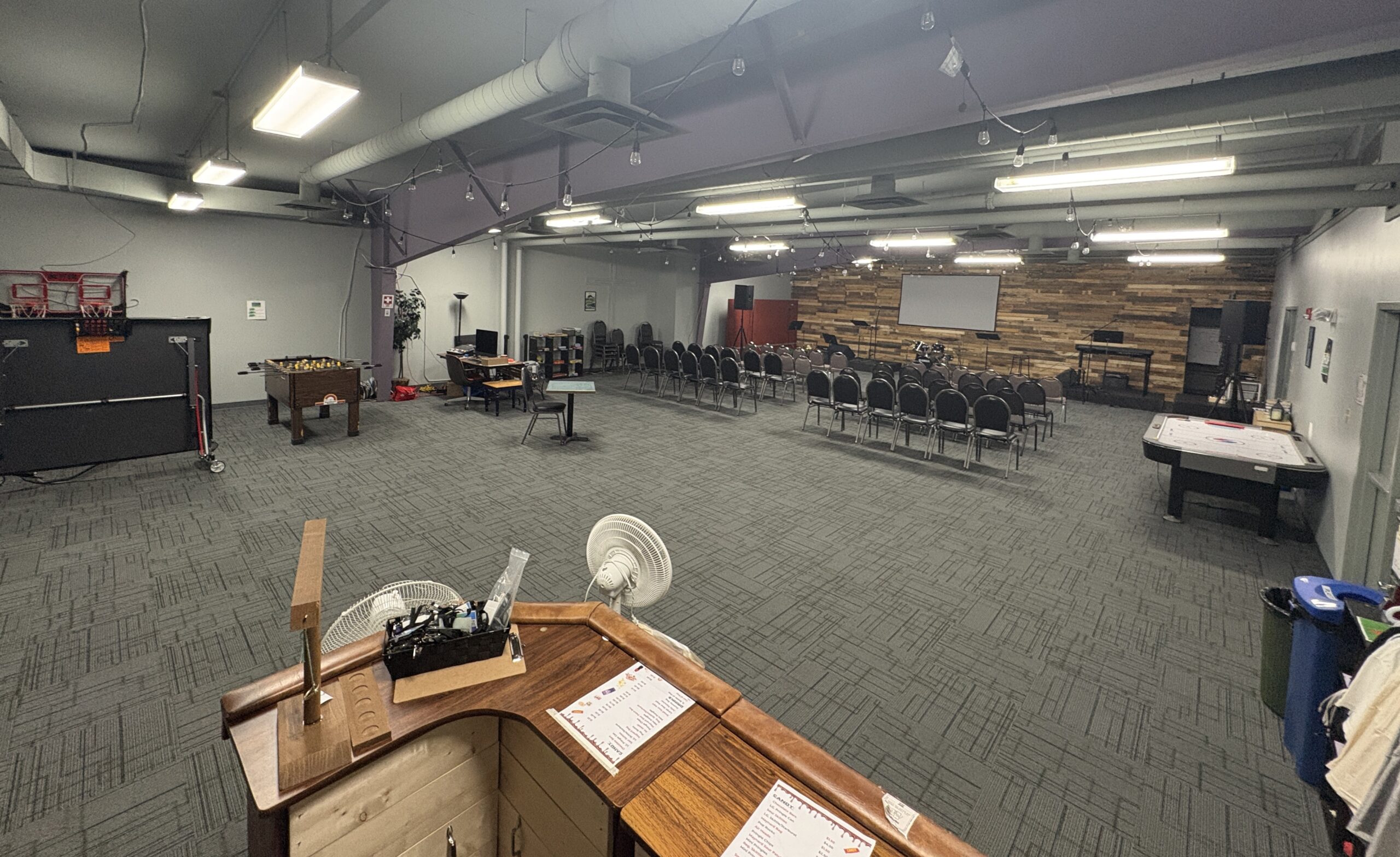 The Hope Youth room — games, chairs, and the stage